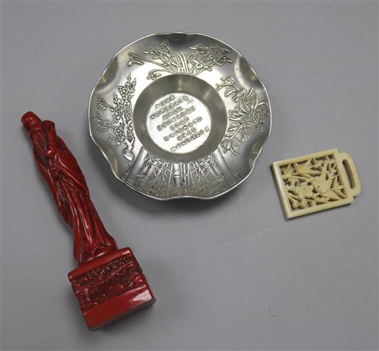 A pair of bronze jue, a Chinese white metal dish, an ivory buckle and a figure